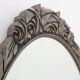 French Art Deco Oval Mirror with Carved Roses and Silver-Painted Frame