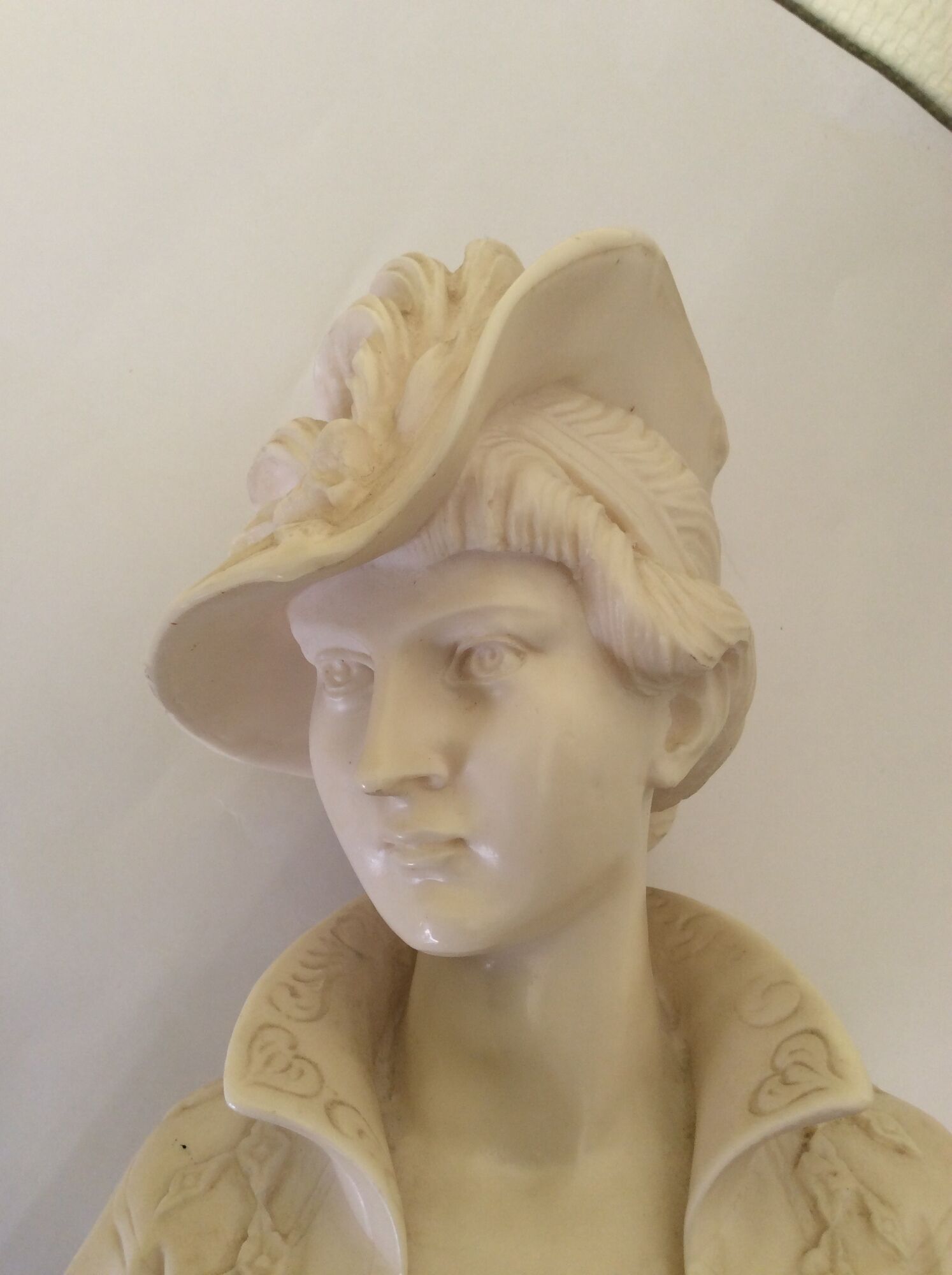 Bust of a young woman in the hat of A. Giannelli