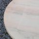 Round neoclassical coffee table with a marble top and golden metal base.
