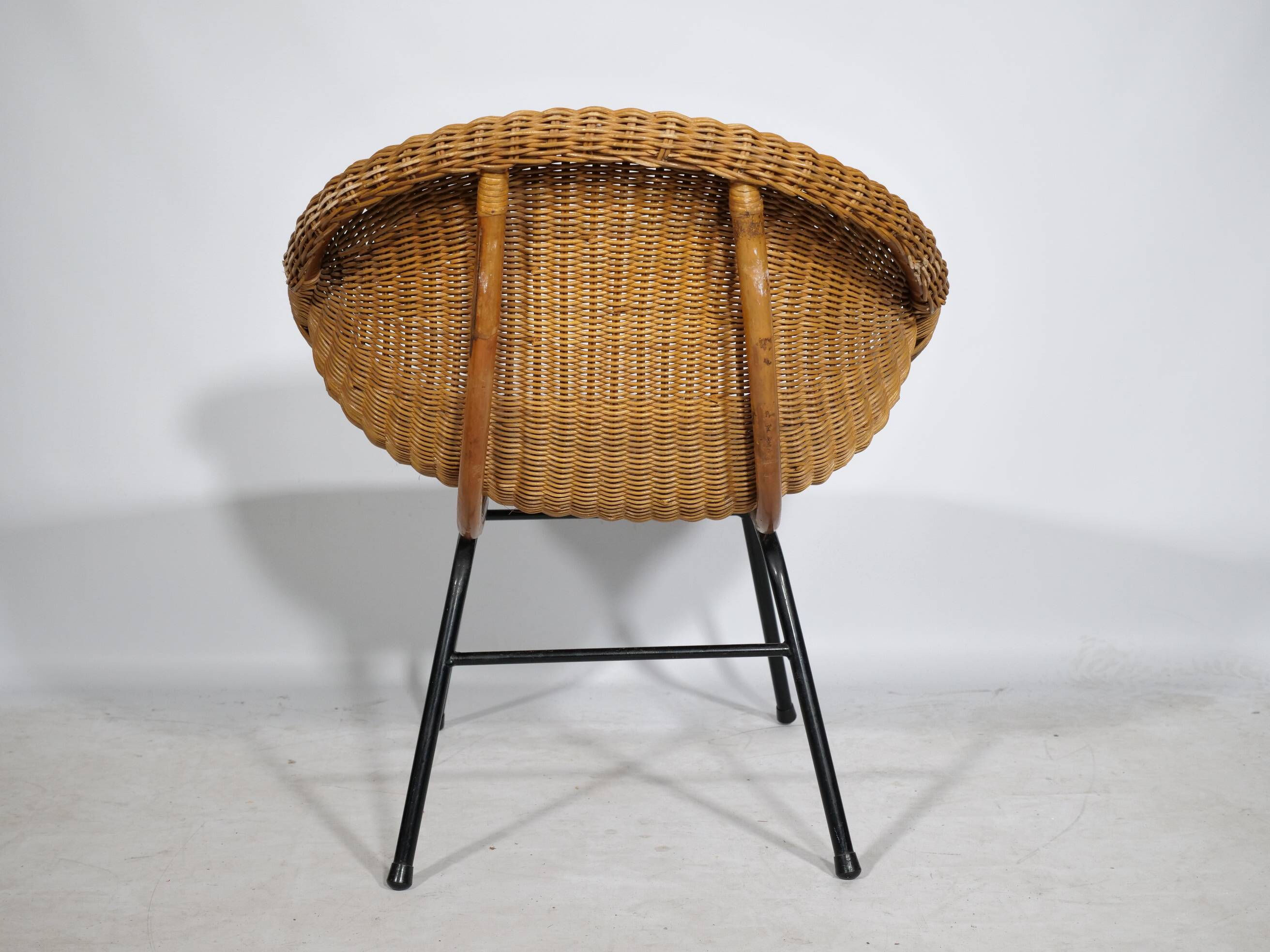 Woven rattan armchair from the 1960s