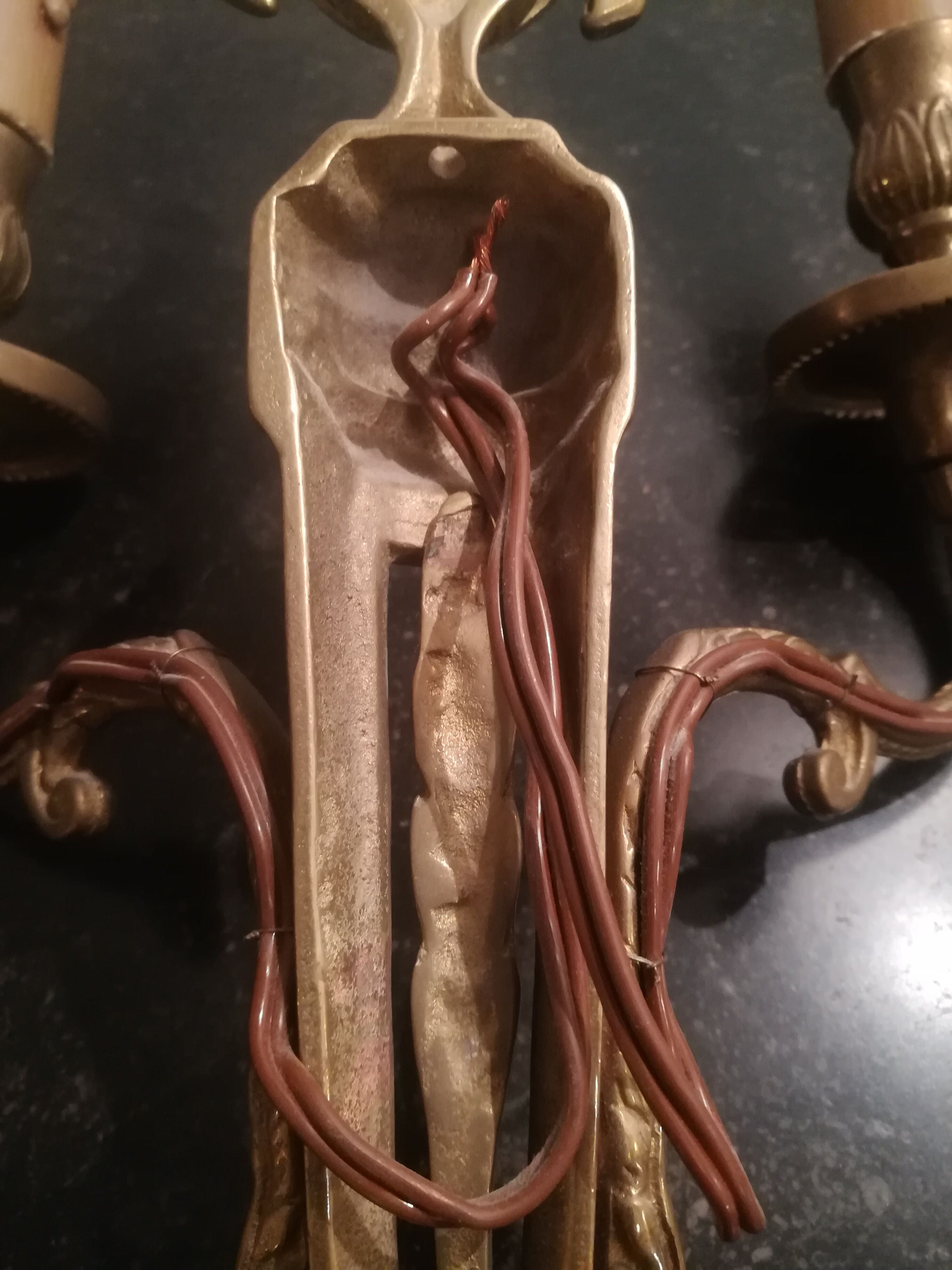 Pair of Louis XVI style sconces in gilded bronze