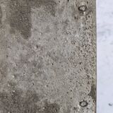 Bas-relief plaque of a rabbit in brown patina, seated cat