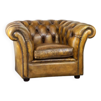 fauteuil Chesterfield anglais en cuir de vachette épais d'une belle couleur