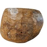 A substantial hand-hewn wooden bowl carved from a single burl section