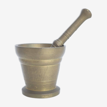 Mortar and apothecary pestle in brass sun decoration