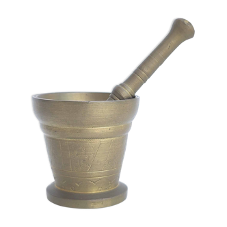 Mortar and apothecary pestle in brass sun decoration