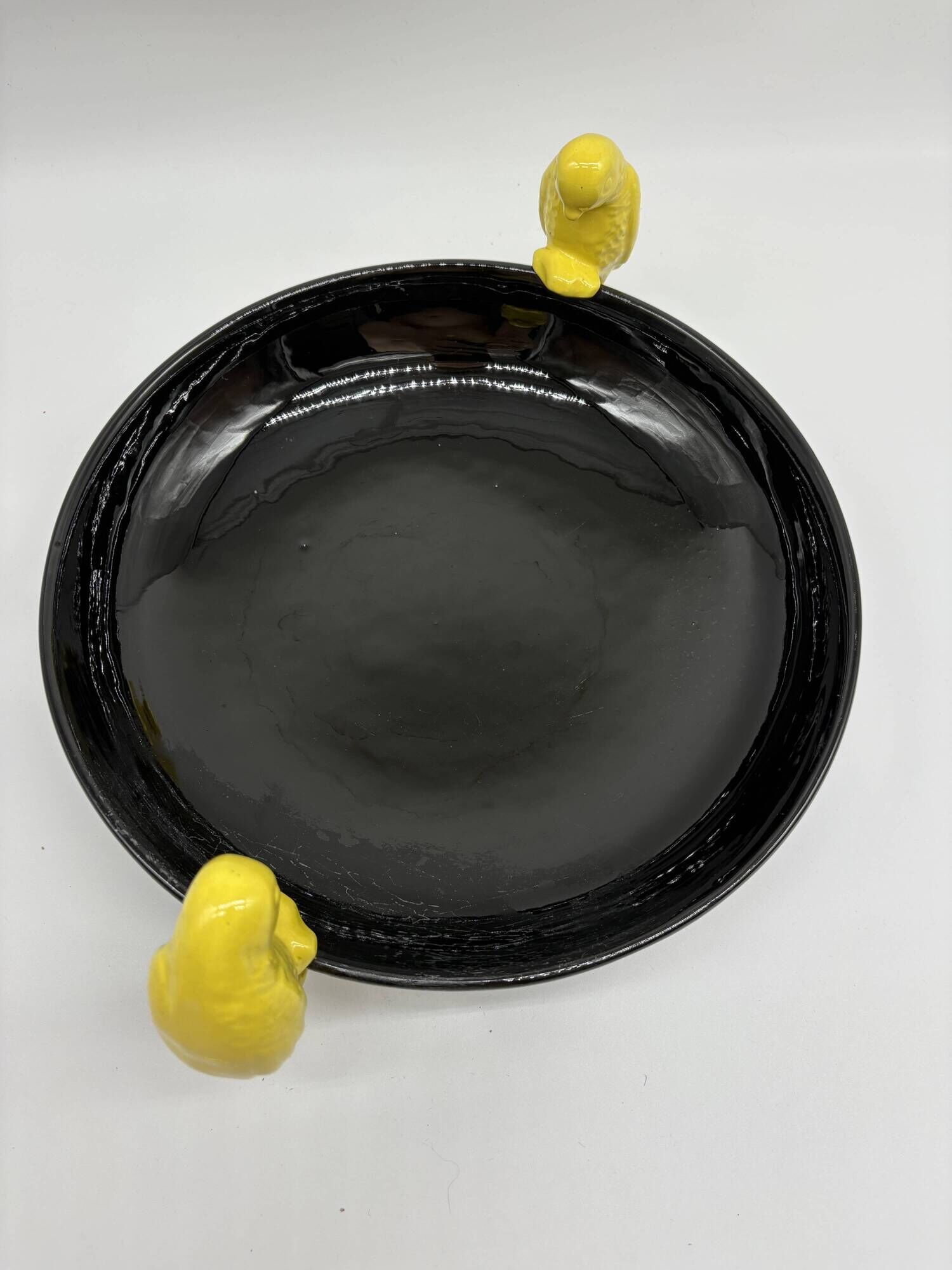 Large vintage black ceramic bowl with yellow parakeets, Vallauris.