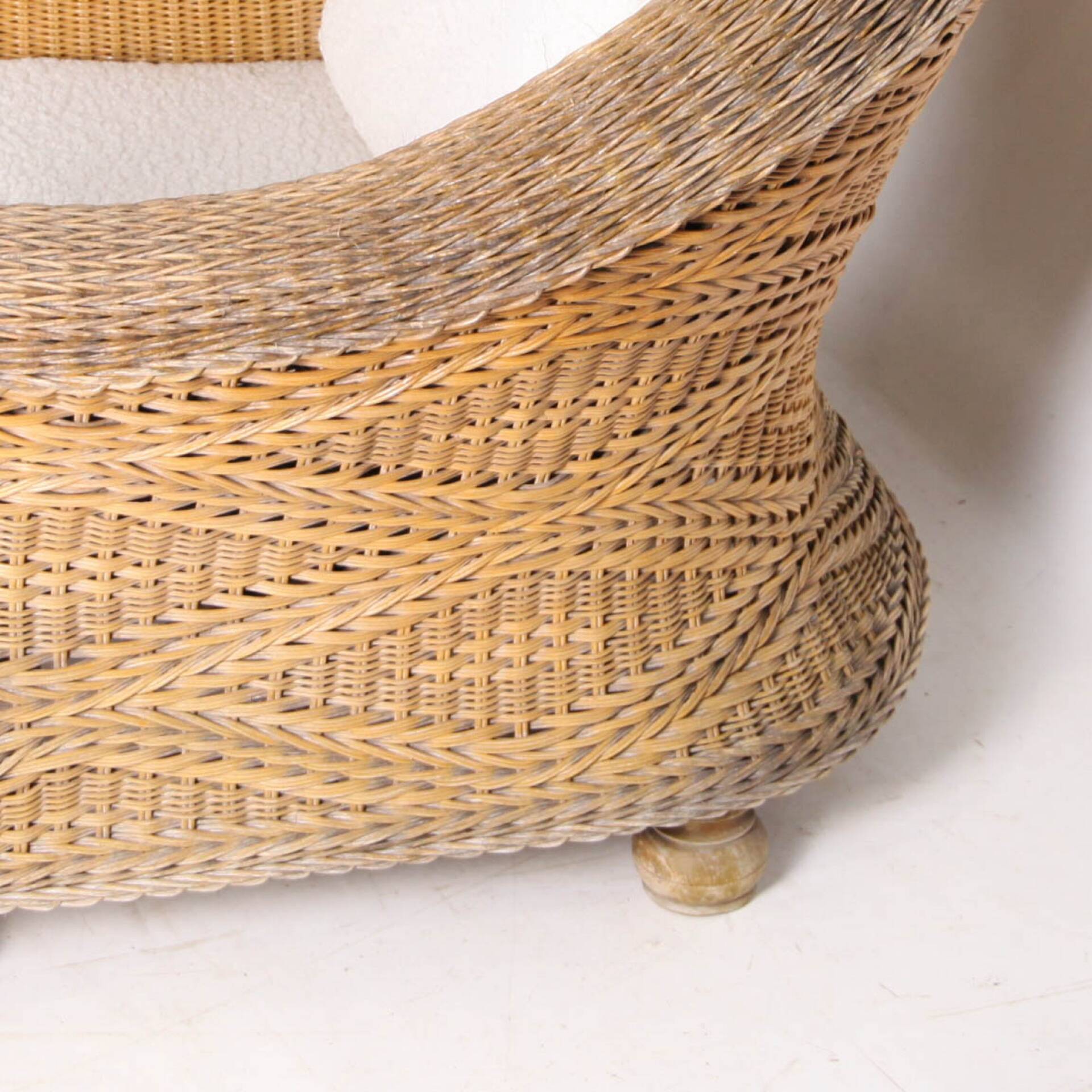Pair of woven wicker armchairs