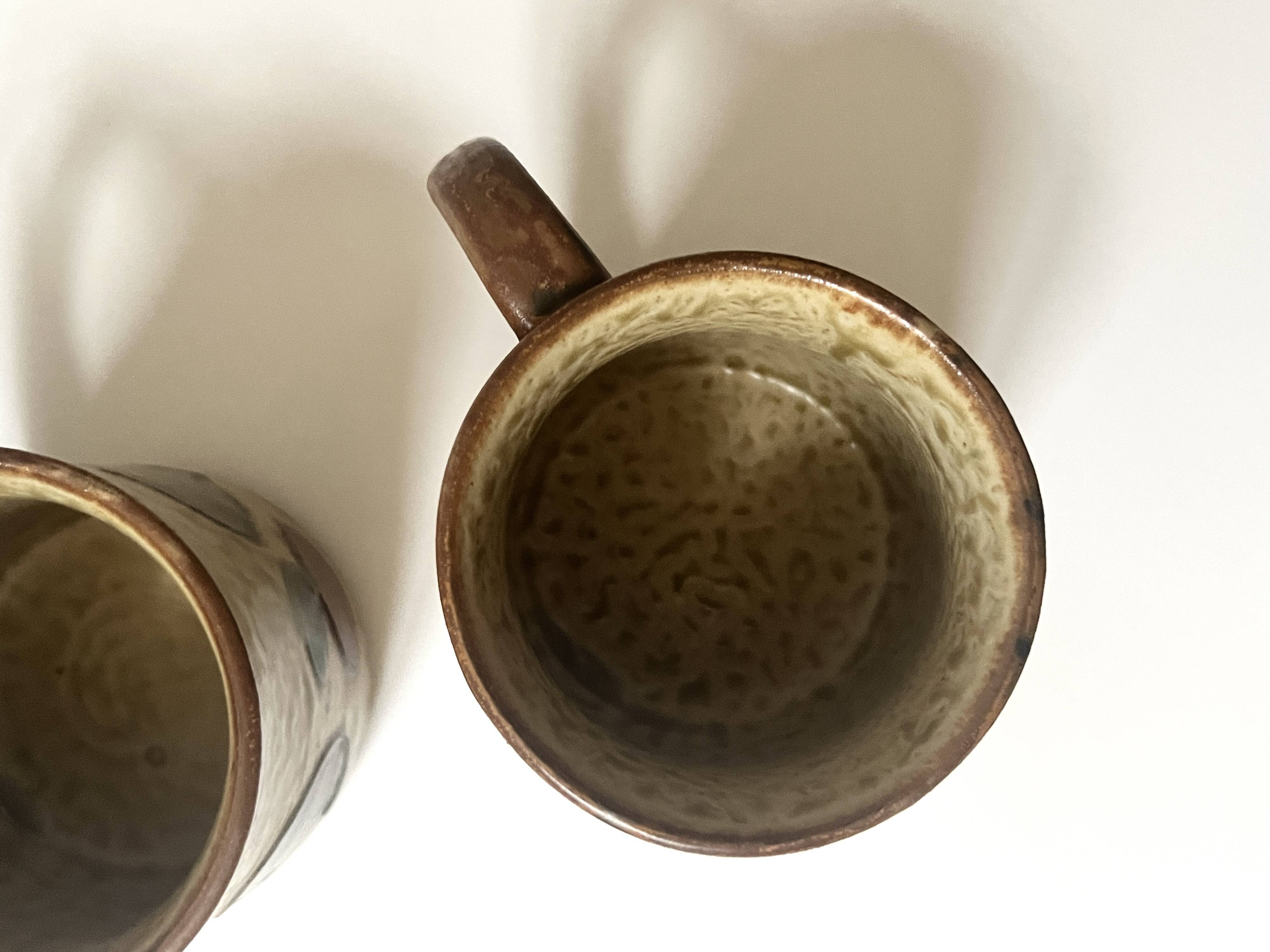 Set of 2 glazed ceramic coffee mugs from around 1970.