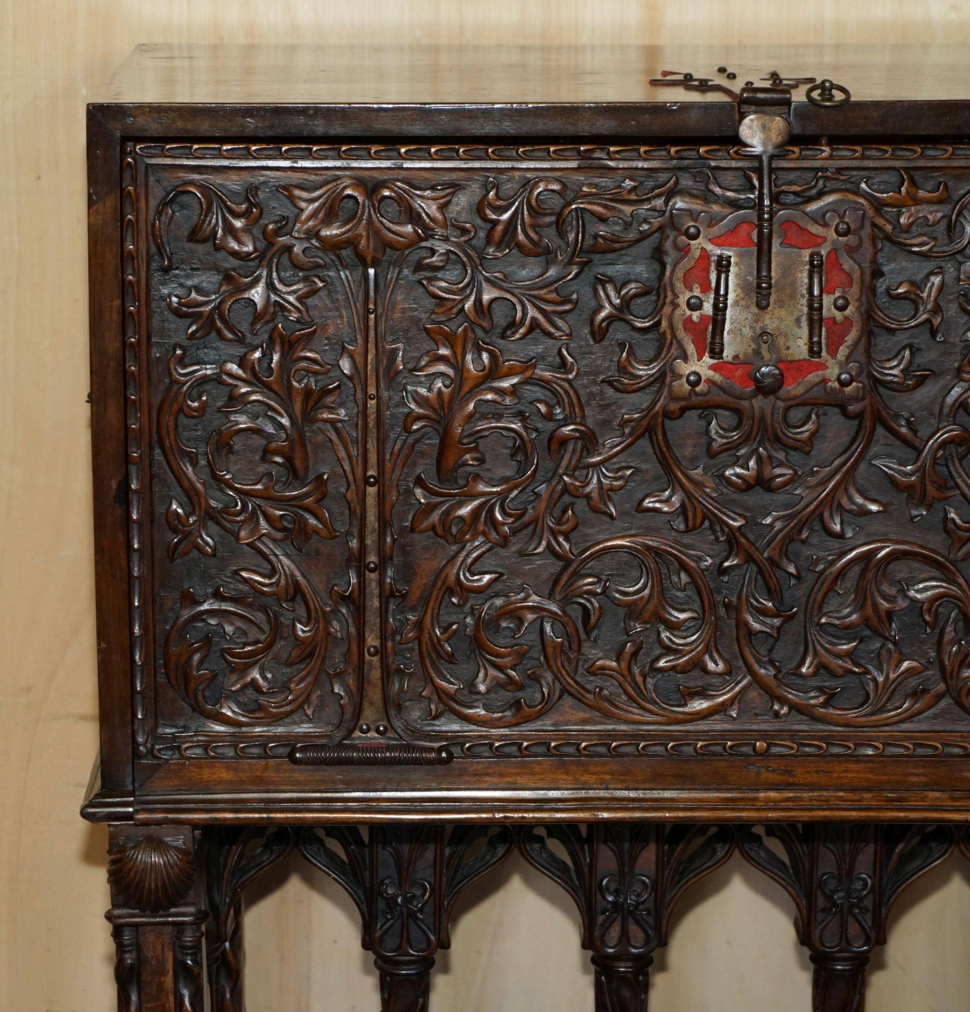 18th-century carved Spanish cabinet with hidden storage.