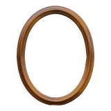 Old large oval wooden wall mirror