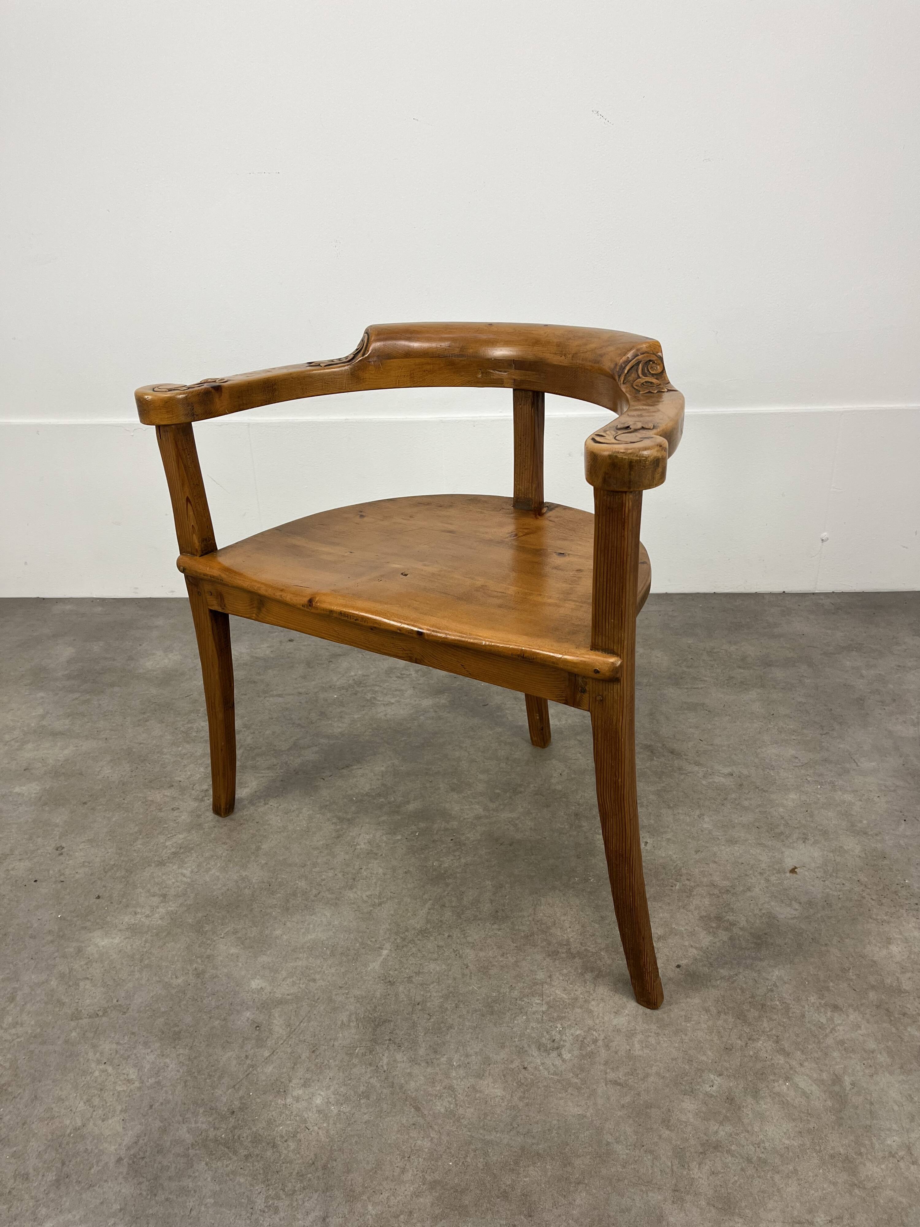 Chalet-style carved wooden tripod armchair