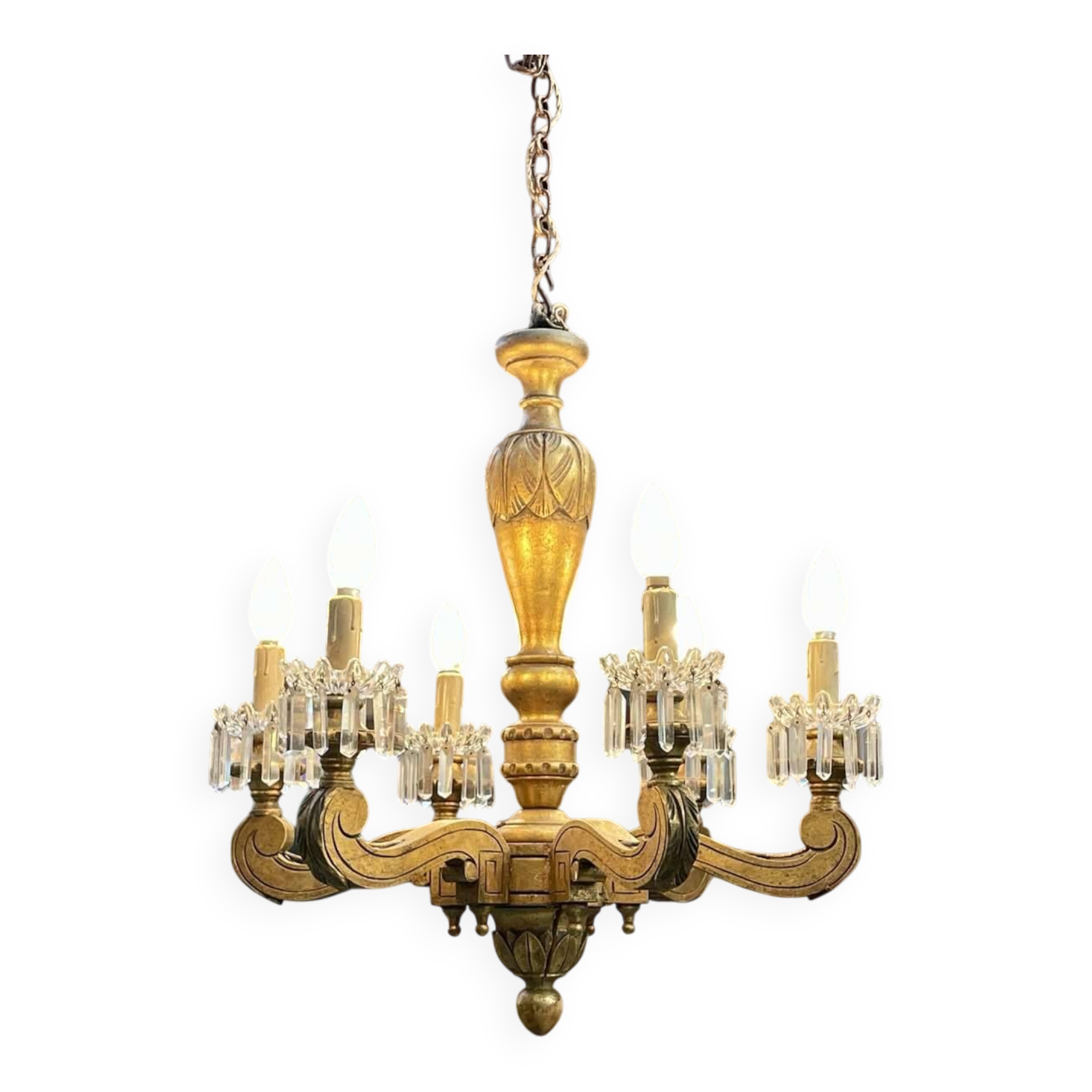 Golden wooden chandelier with crystal pendants from the 19th century.