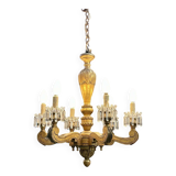 Golden wooden chandelier with crystal pendants from the 19th century.