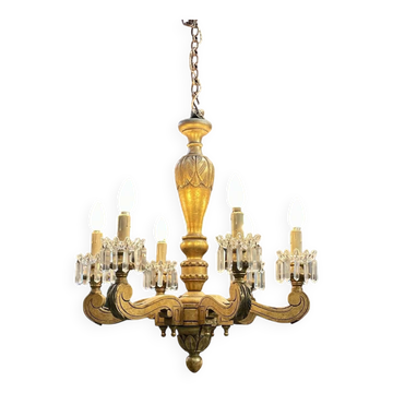 Golden wooden chandelier with crystal pendants from the 19th century.