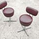 Set of 4 Mid Century Modern swivel chairs in tubular steel and leather.