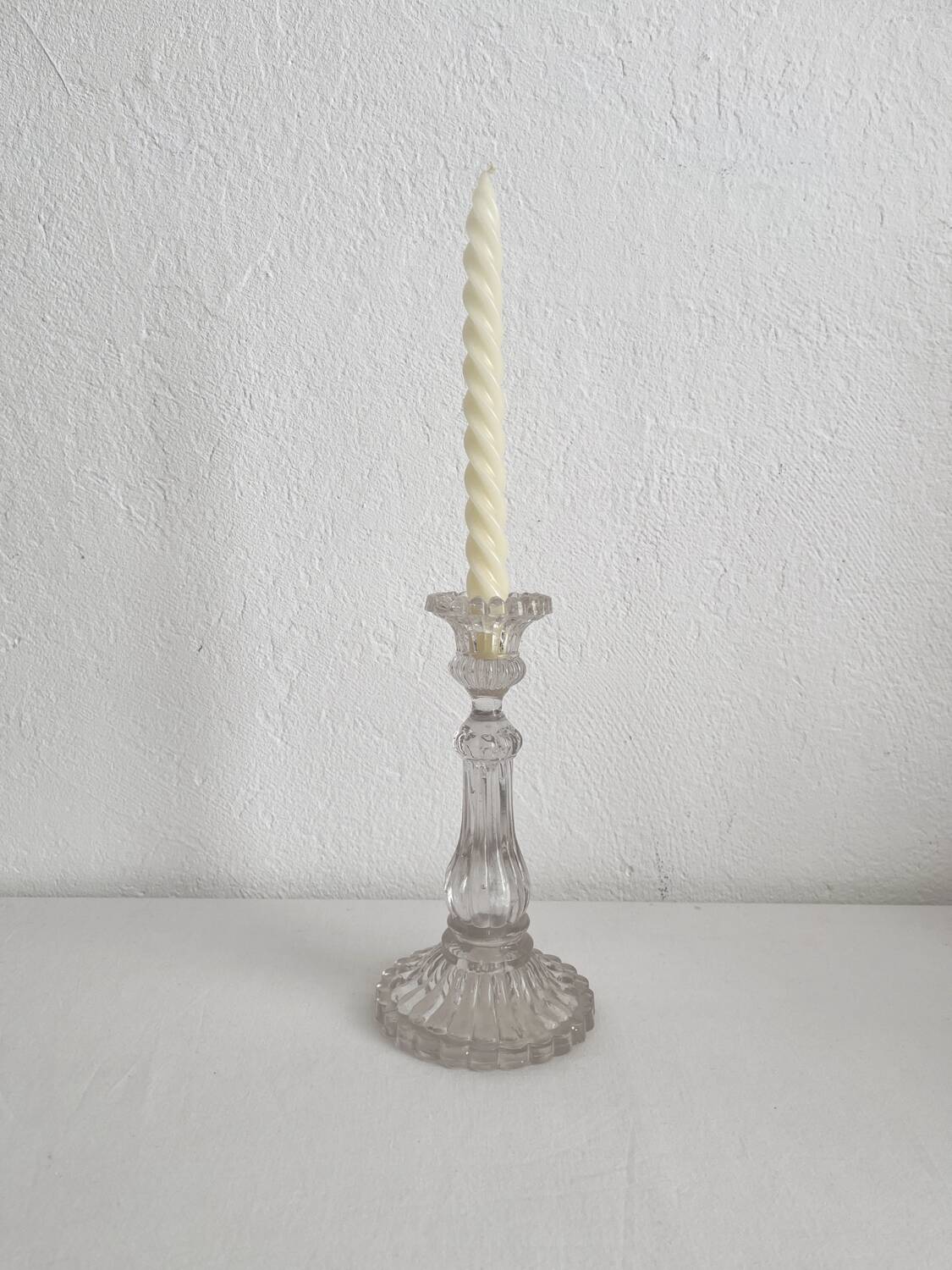 Antique baluster-shaped molded glass candlestick holder