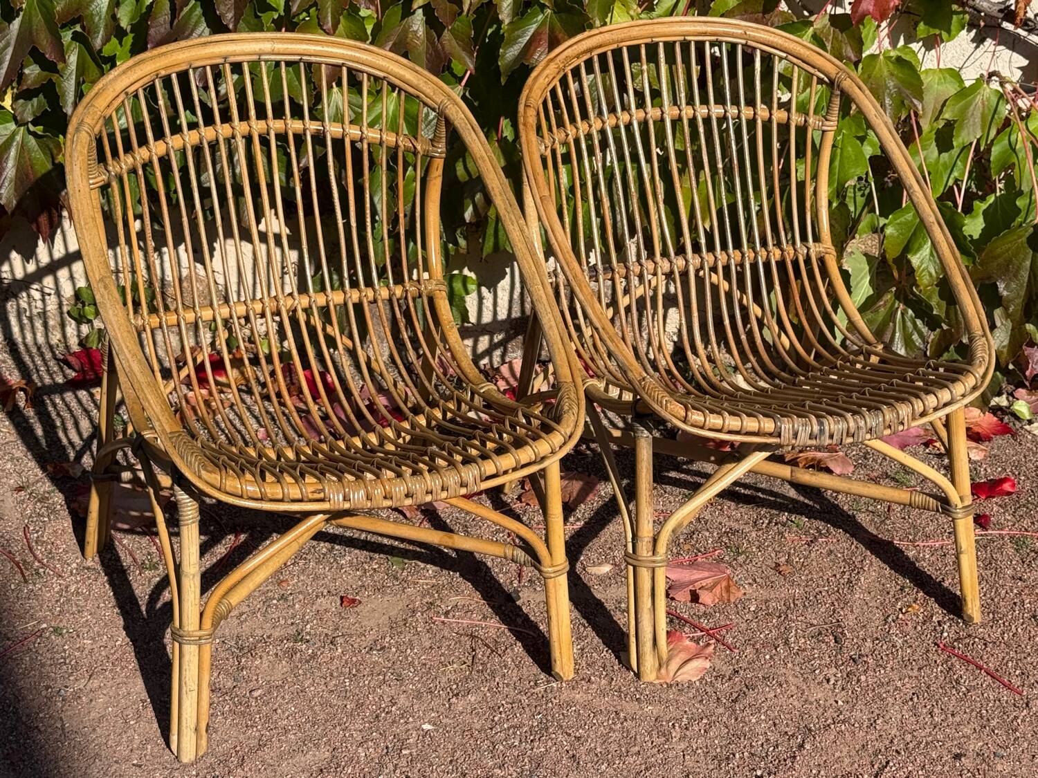 Pair of 1950s rattan armchairs from France.