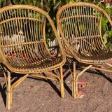 Pair of 1950s rattan armchairs from France.