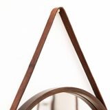 Round mirror in walnut