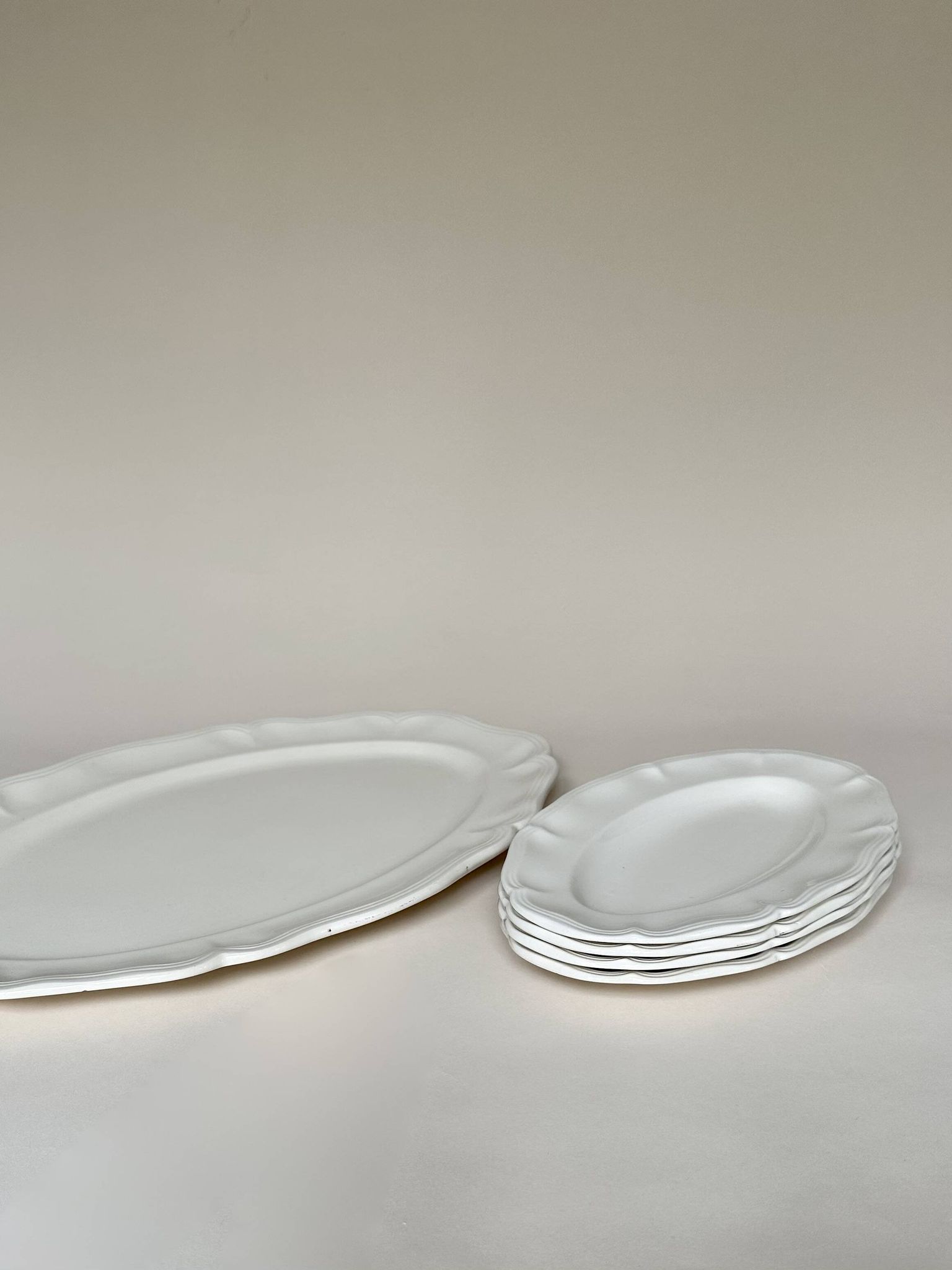 Shaped plates and dishes in Sarreguemines earthenware.