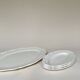Shaped plates and dishes in Sarreguemines earthenware.