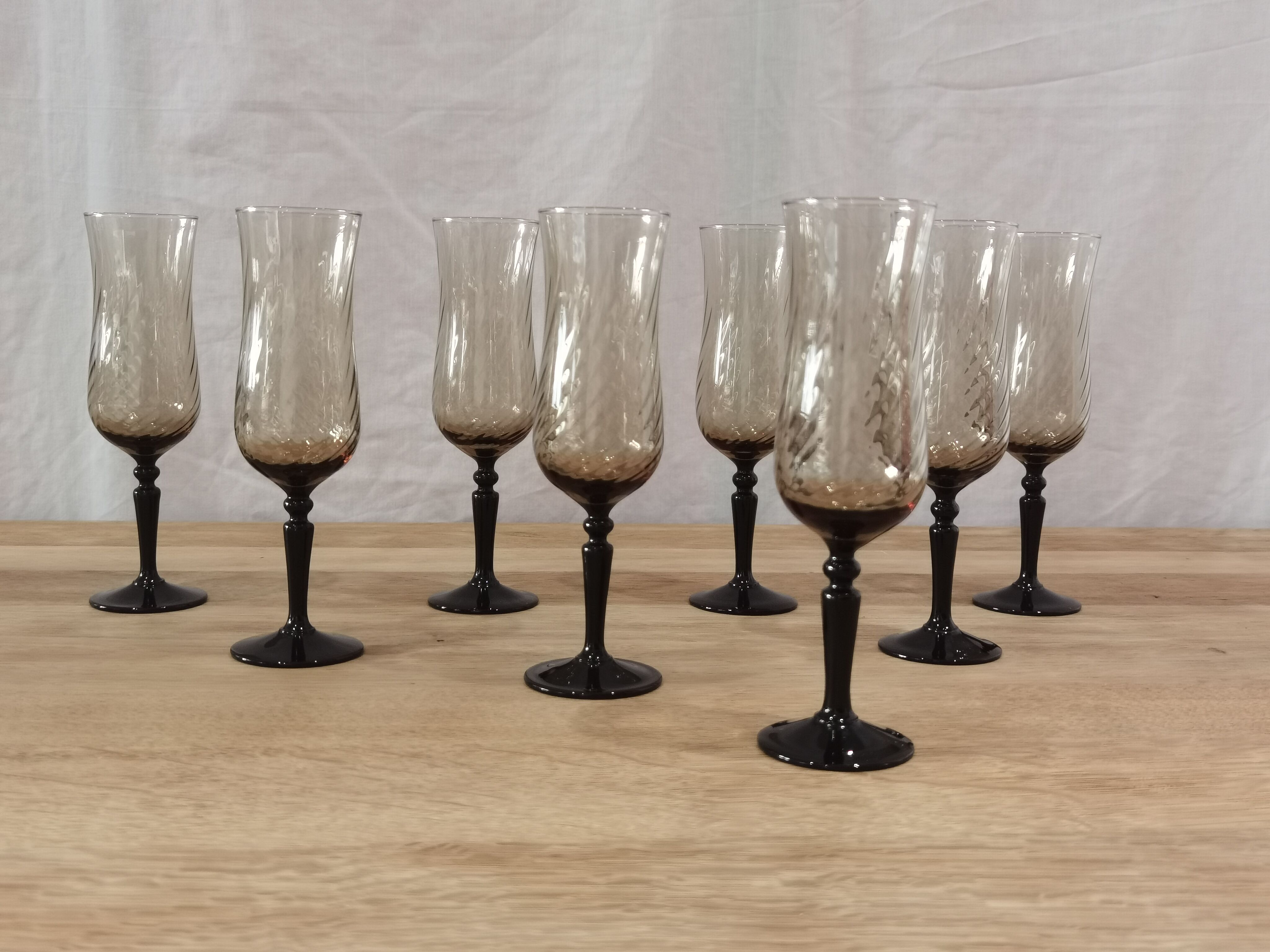8 vintage smoked champagne flutes with black feet Arcoroc