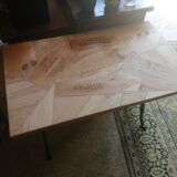 Inlaid bistro table with cases of wine.