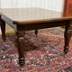 Victorian-style mahogany English table with 3 extensions.