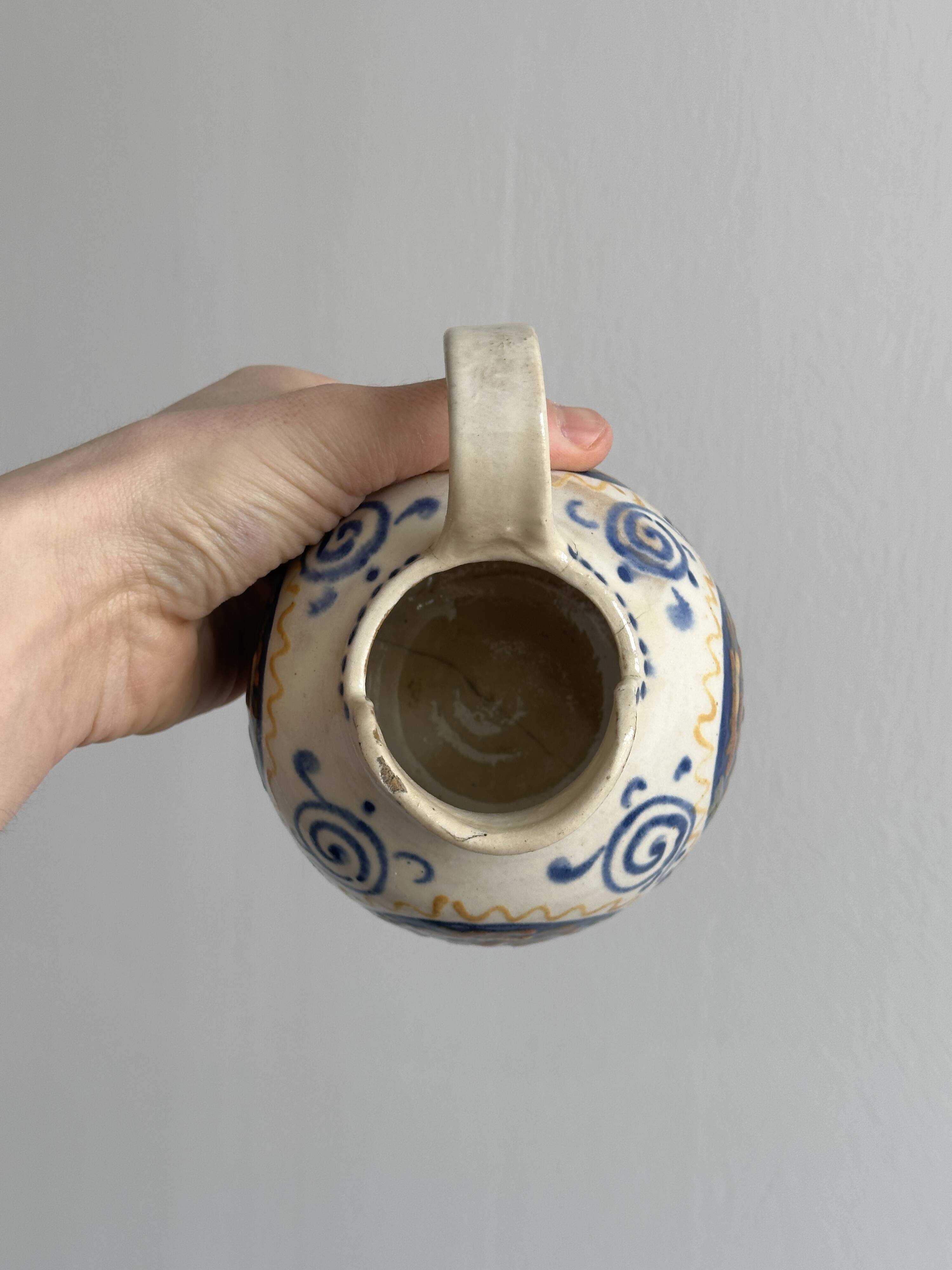 Hand painted ceramic decorative pitcher