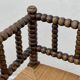 Art Deco turned wood straw corner armchair