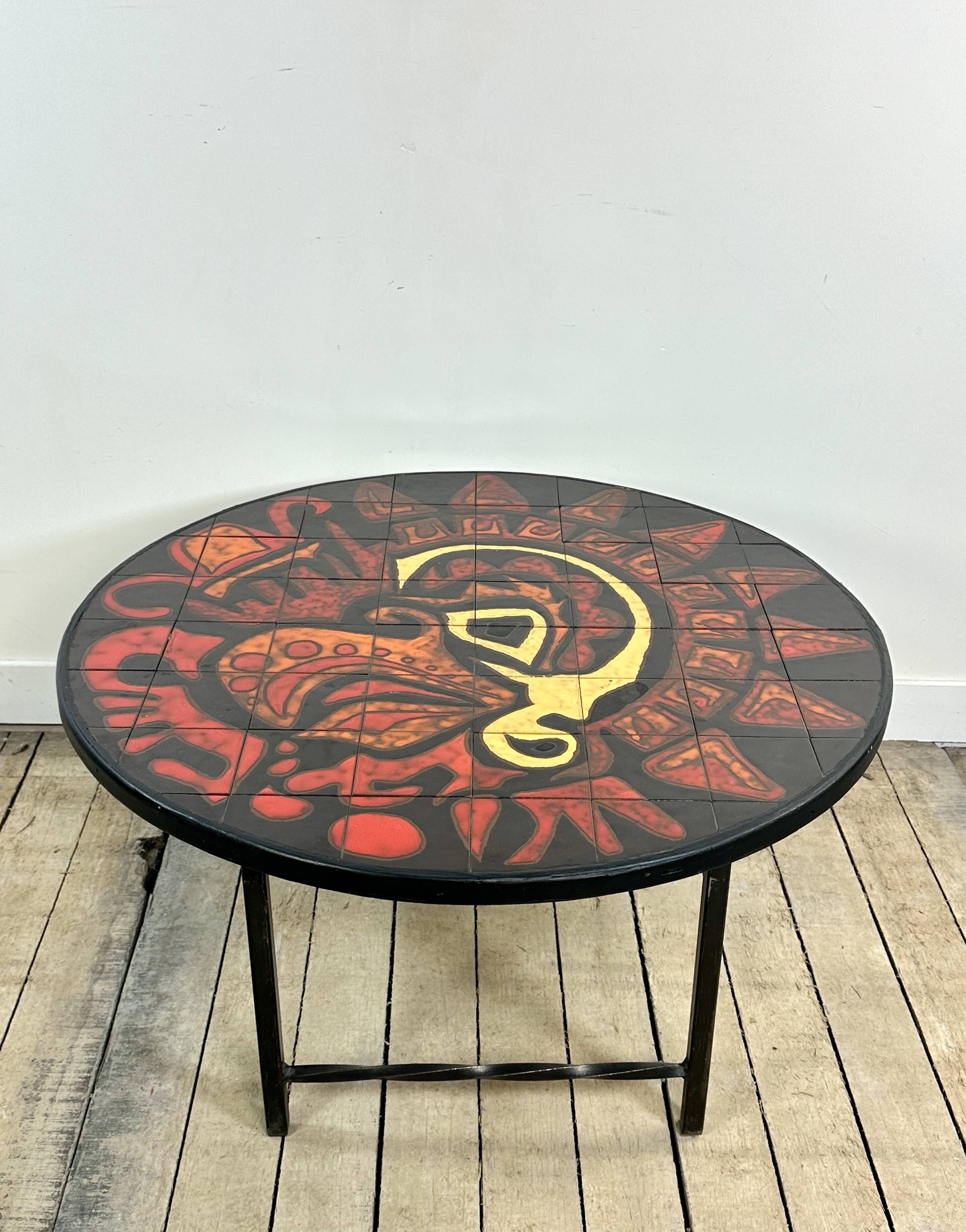 Vintage round coffee table in graphic red and yellow ceramic from the 1960s.