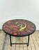 Vintage round coffee table in graphic red and yellow ceramic from the 1960s.