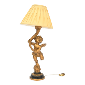 Golden resin angel mounted in lamp