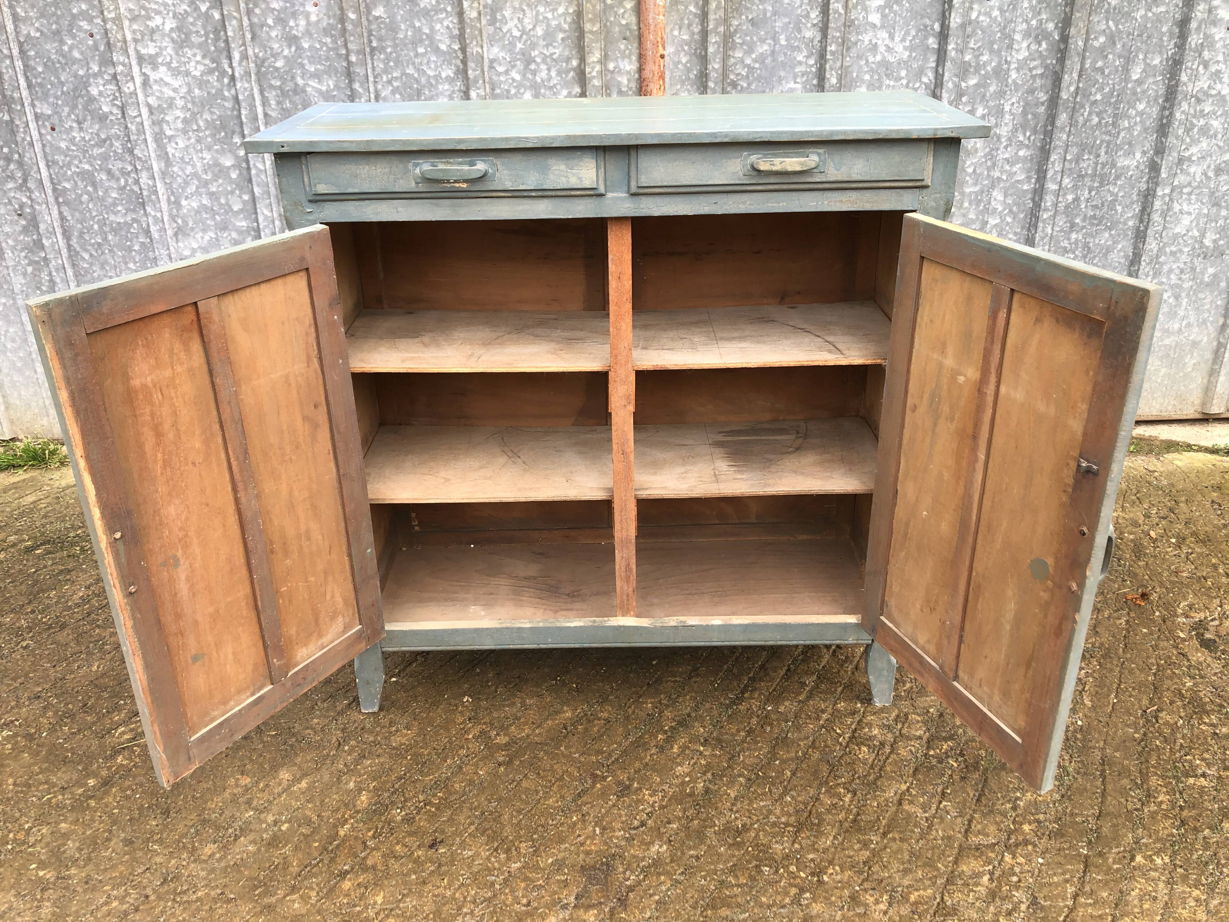 Parisian sideboard painted in blue with 2 doors and 2 drawers.