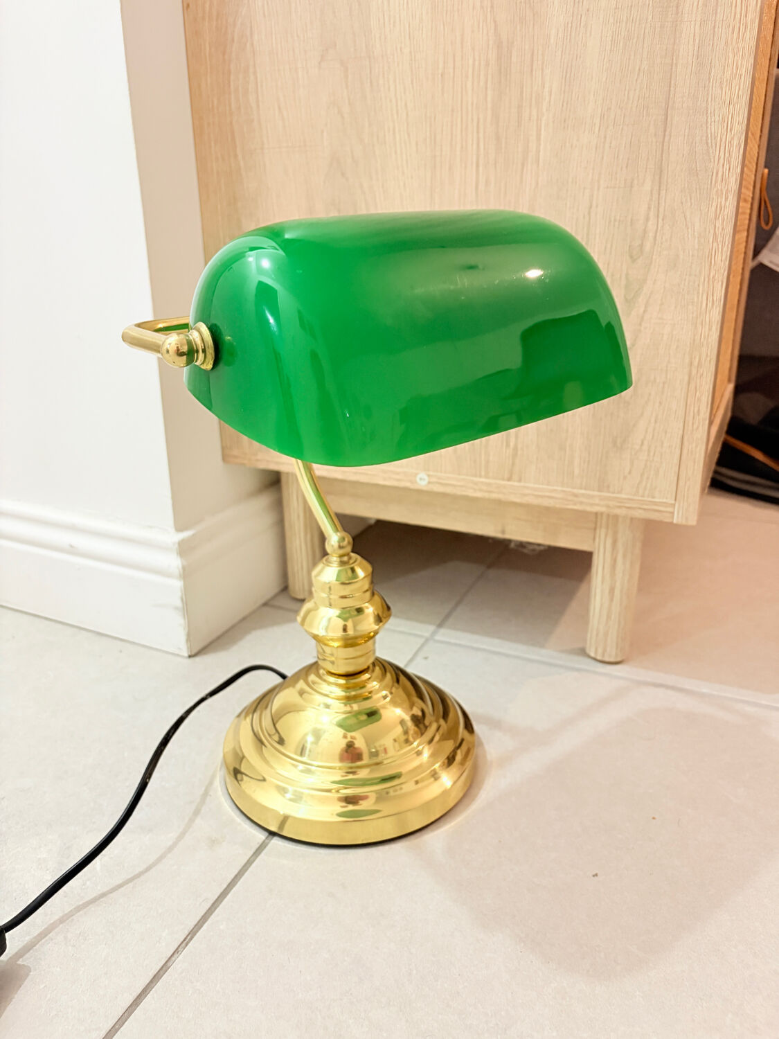 Gold and green banker’s desk lamp.