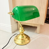 Gold and green banker’s desk lamp.