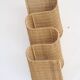 rattan wave wall-mounted magazine holder