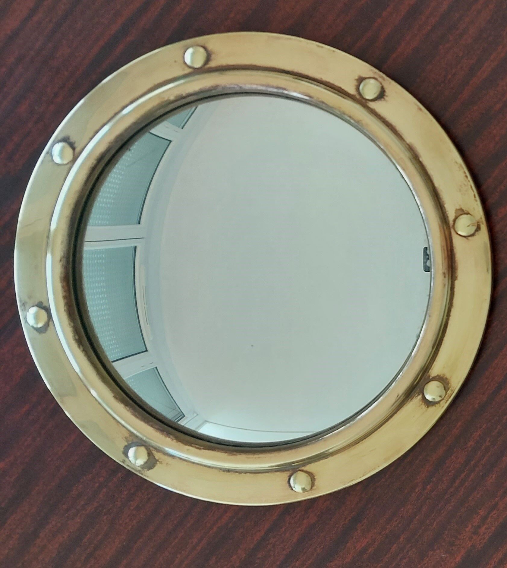 Witch porthole mirror 1940 in vintage gilded brass.
