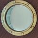 Witch porthole mirror 1940 in vintage gilded brass.