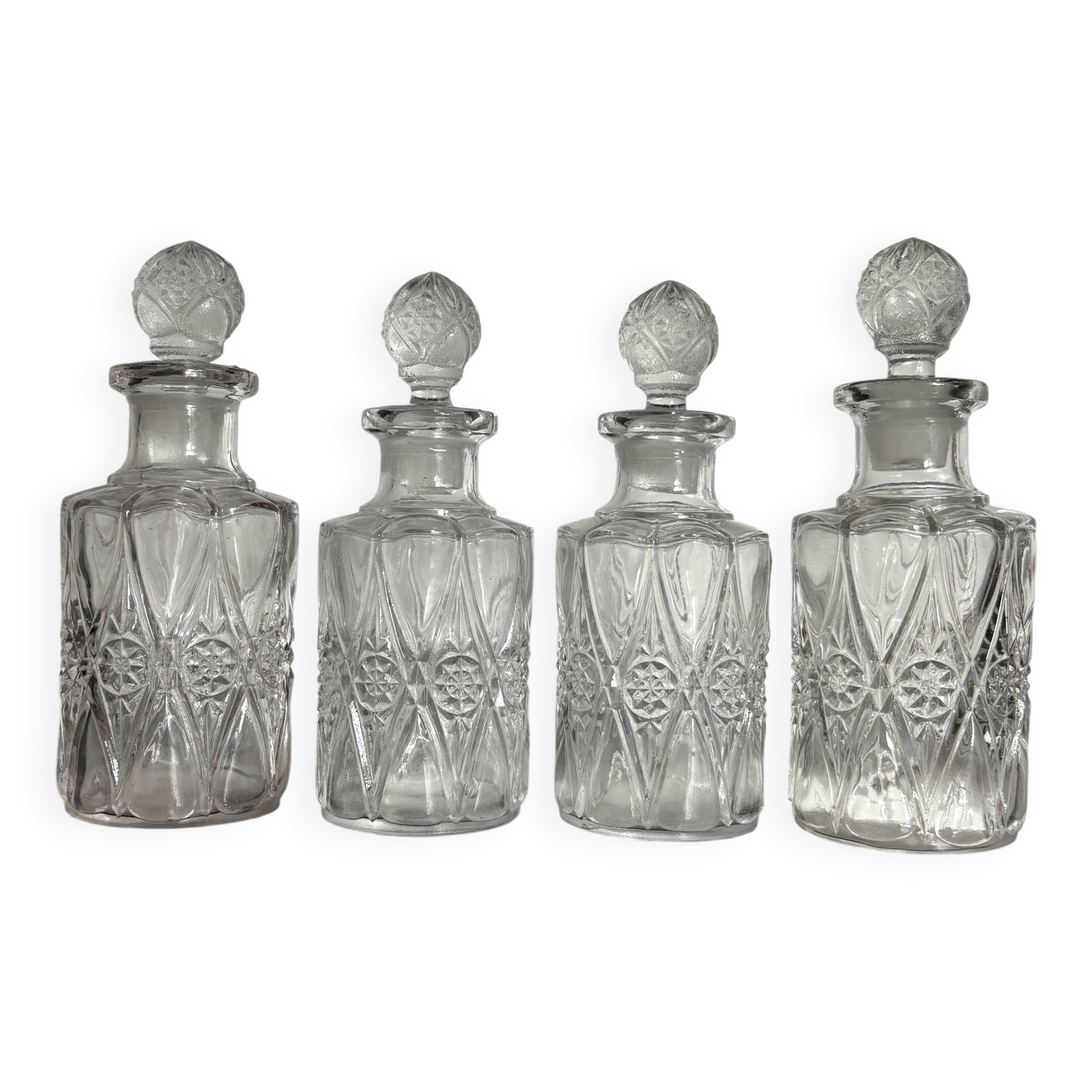 Set of 4 molded crystal bottles – Val Saint Lambert