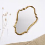 Old wooden mirror gilded with gold leaf