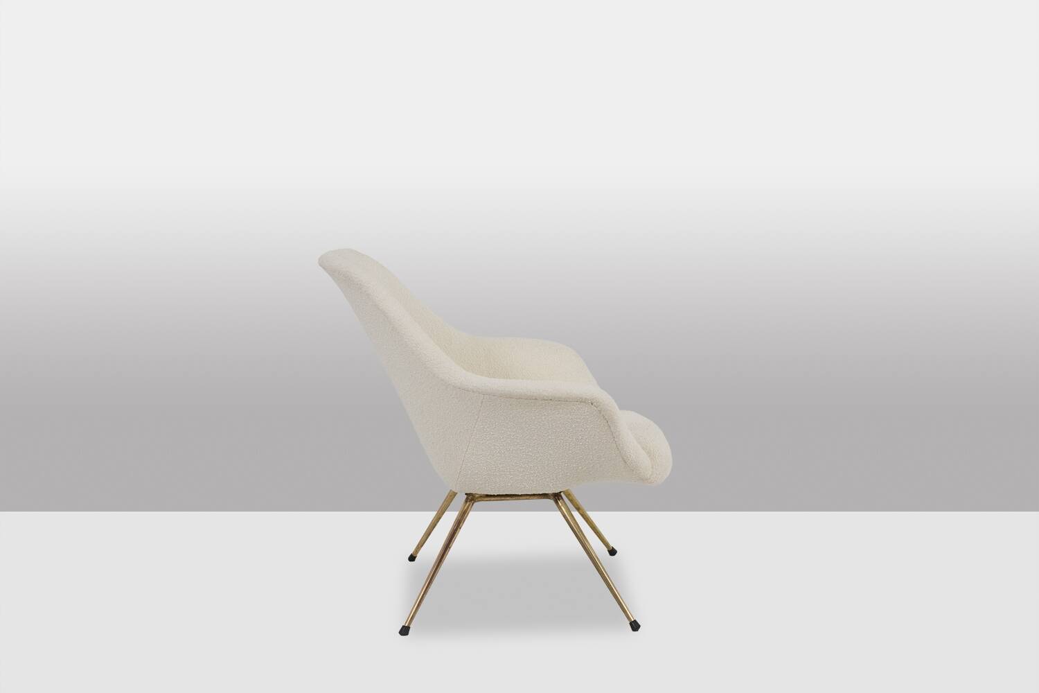 Pair of cocktail armchairs in gilded brass. 1960s.