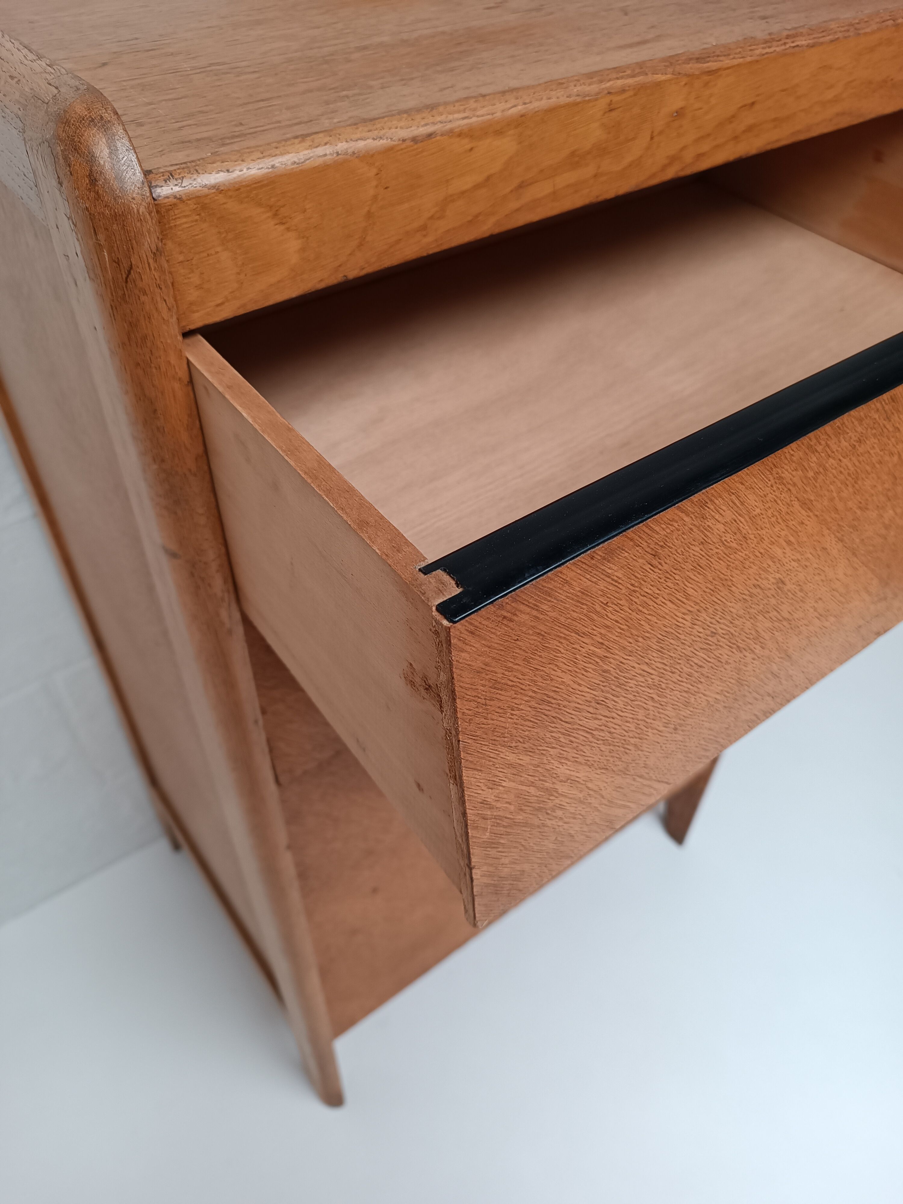 High wooden chest of drawers in the 50s