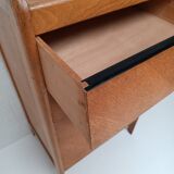 High wooden chest of drawers in the 50s