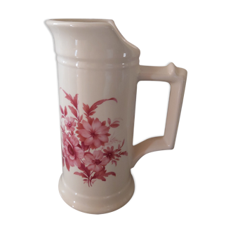 Pitcher vase with bouquet of pink flowers