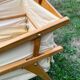Wooden designer travel cot