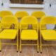 Ensemble de six chaises en métal pliantes jaunes Eurosit