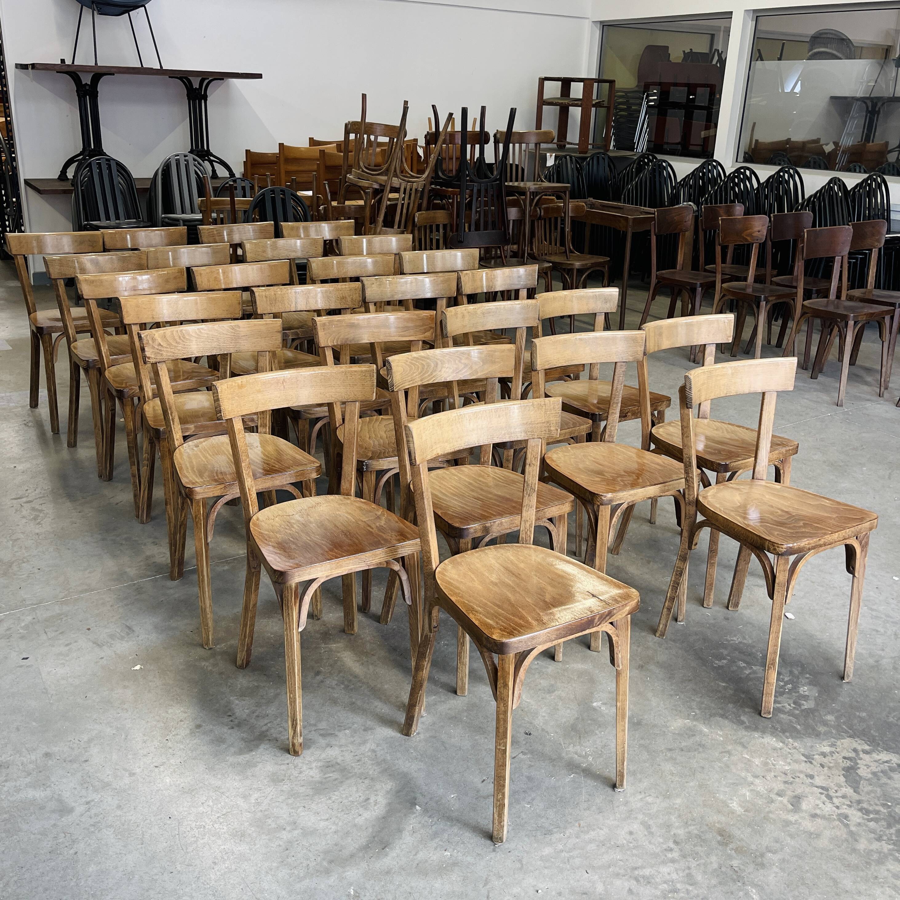 Set of 26 Baumann wooden bistro chairs from the 1950s France