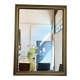 Vintage rectangular wall mirror with a golden wooden frame.